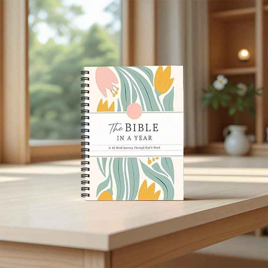 Undated spiral-bound Bible study journal with floral "The Bible in a Year" cover