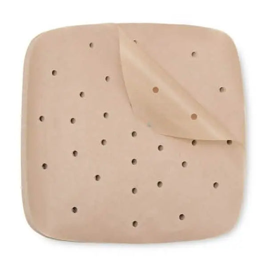 Brown square air-fryer parchment papers, perforated holes, stacked