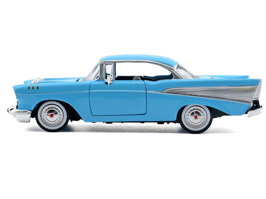 Light blue Chevrolet Bel Air 1/24 die-cast model car, side view with chrome trim and tires