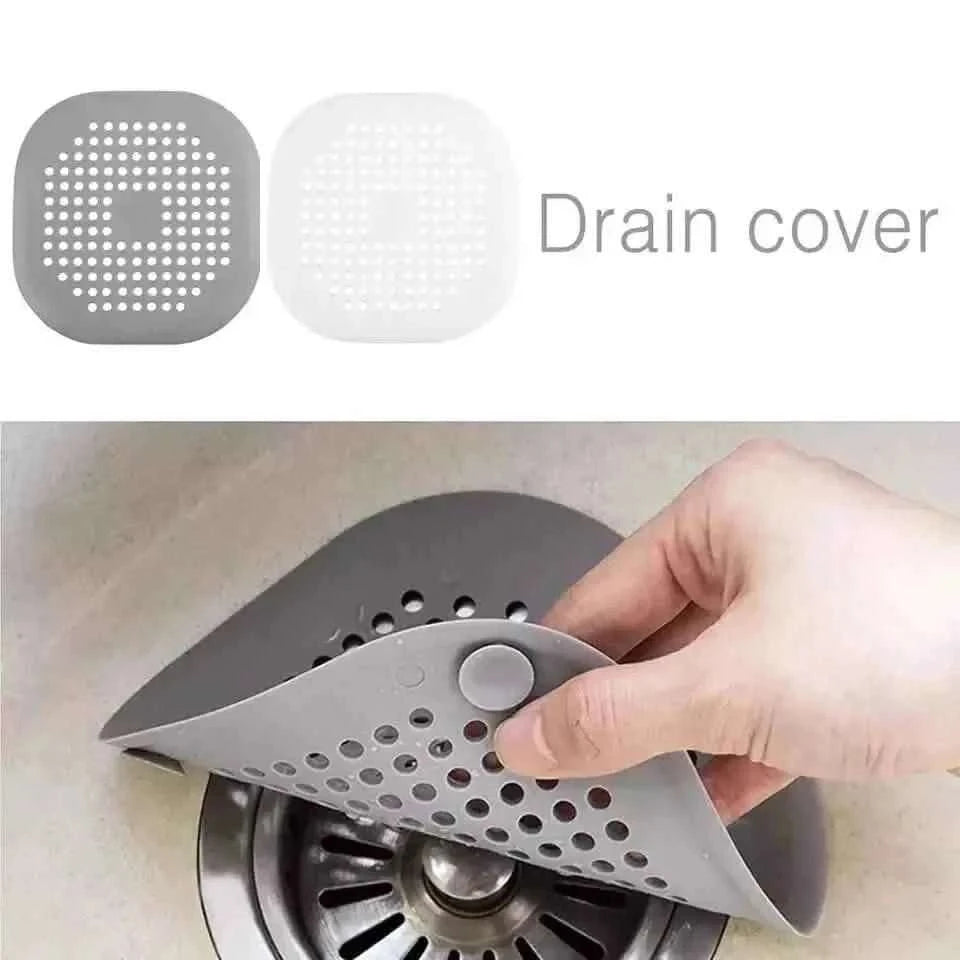 Set of two round drain cover strainers, gray and white with perforated hole grids.