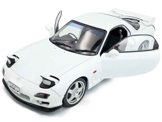 White 1/18 diecast sports car model, front-left three-quarter view with wheels