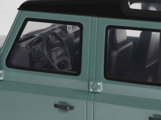 Green Defender model car side door and window detail, black roof section