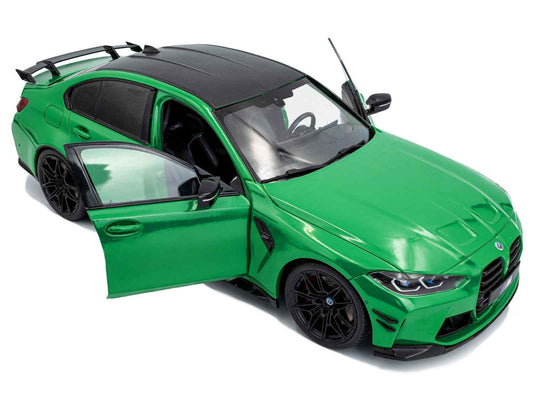 Green diecast model car with doors open, black wheels, front side view