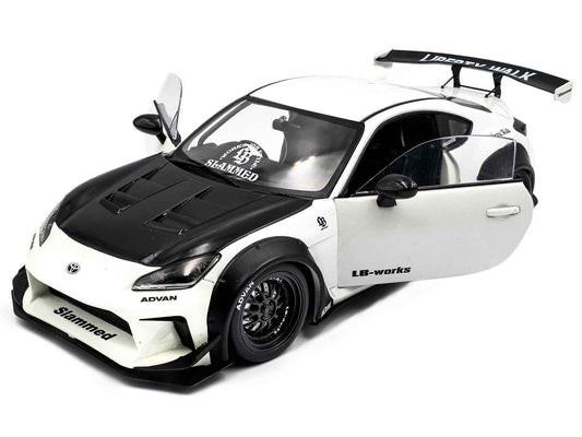 Solido 1:18 diecast coupe model car, white with carbon hood, front 3/4 view