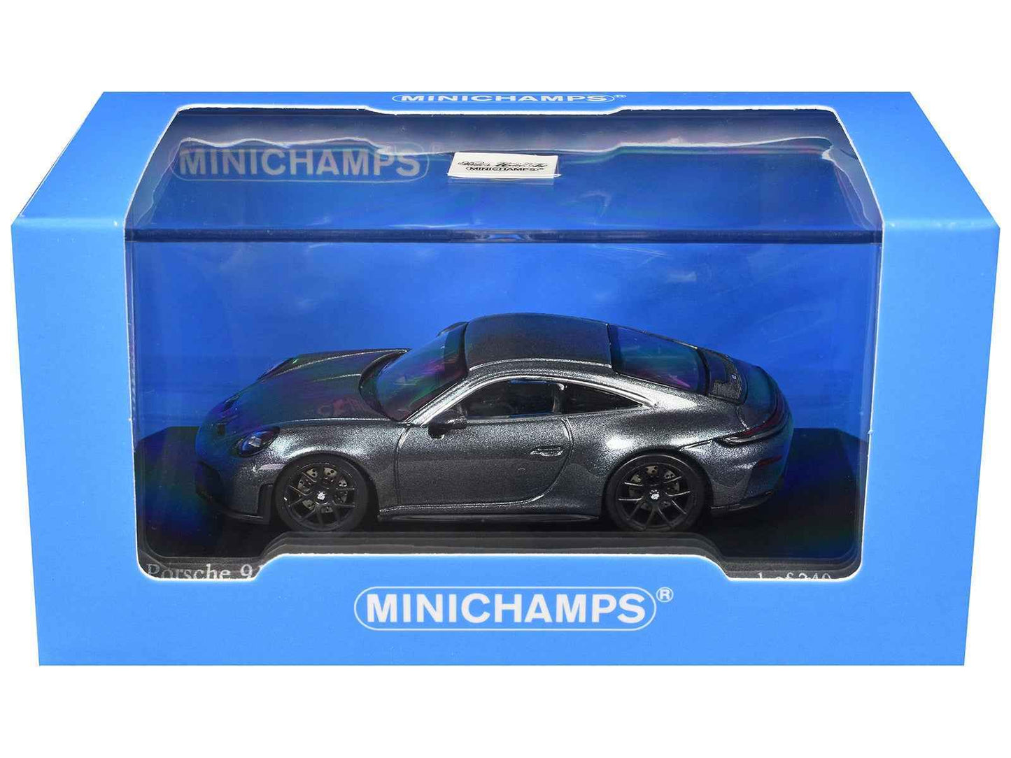 Metallic gray 1/64 diecast sports car model in blue MINICHAMPS display box