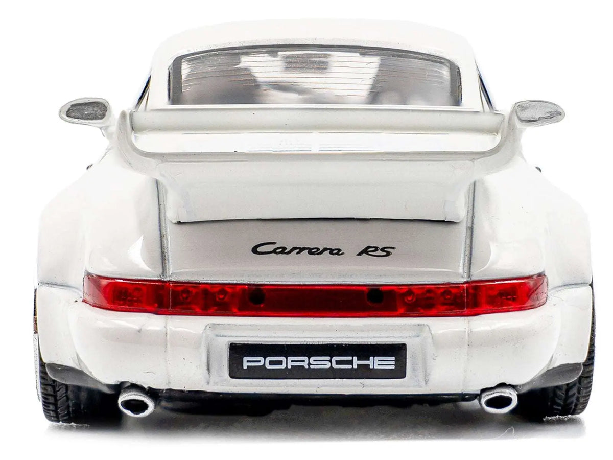 White Porsche 911 diecast model car, rear view with Carrera RS script and dual exhaust tips.