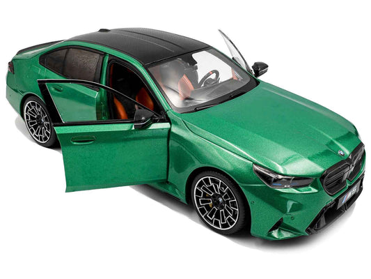 Green BMW M5 1:18 diecast model car, left-side view with door open.
