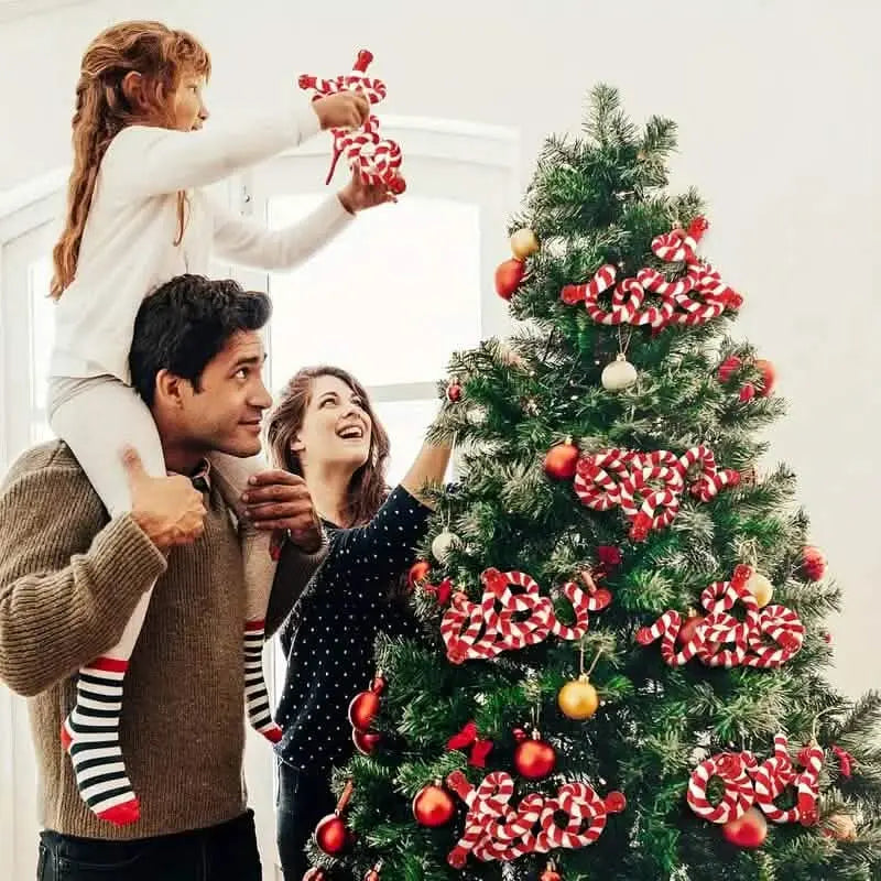 Red and white striped spiral candy Christmas decoration picks on Christmas tree