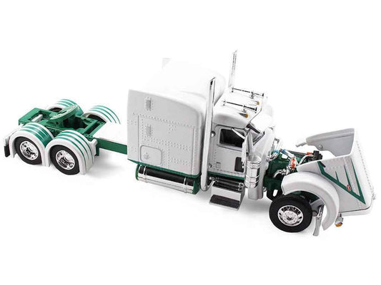 White diecast semi truck with green trim, cab open with detailed engine and chassis