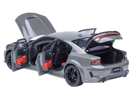 Autoart 1:18 gray Dodge Charger model car with doors open, black interior and wheels.