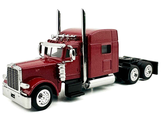 Red metallic sleeper-cab semi truck model with chrome grille and dual rear wheels