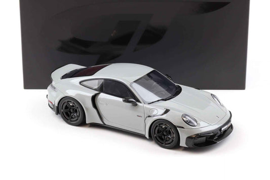 White die-cast sports car model with open front angle, black wheels and hood vents, 1:18