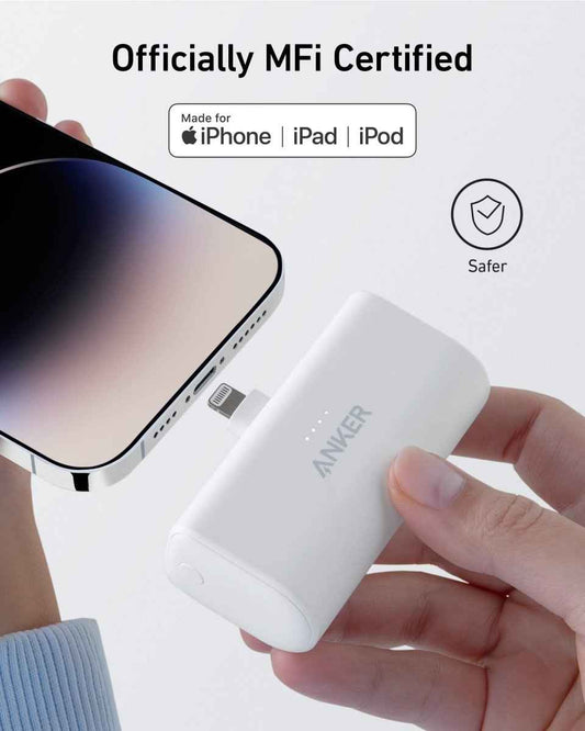 White nano power bank with built-in Lightning connector, held in hand