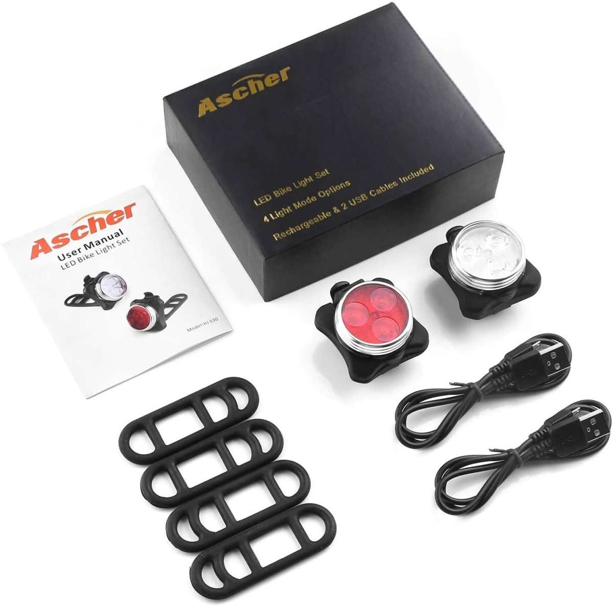 Bike light set box with manual, two lights, mounting straps, and USB charging cable