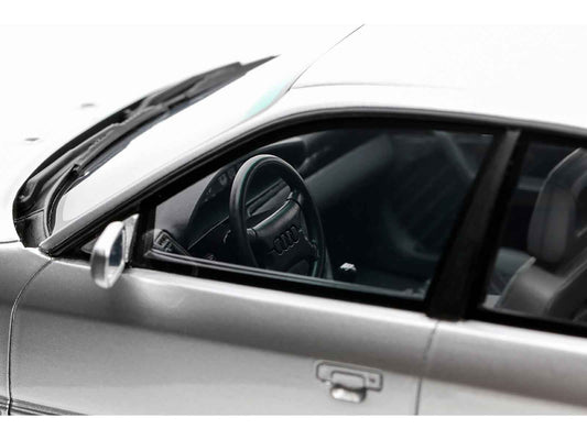 Silver Audi S4 model car interior view with black steering wheel