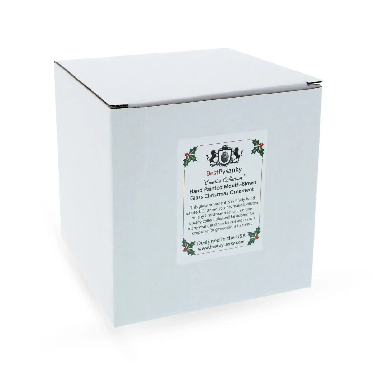 White gift box with a decorative label for a hand-painted glass Christmas ornament