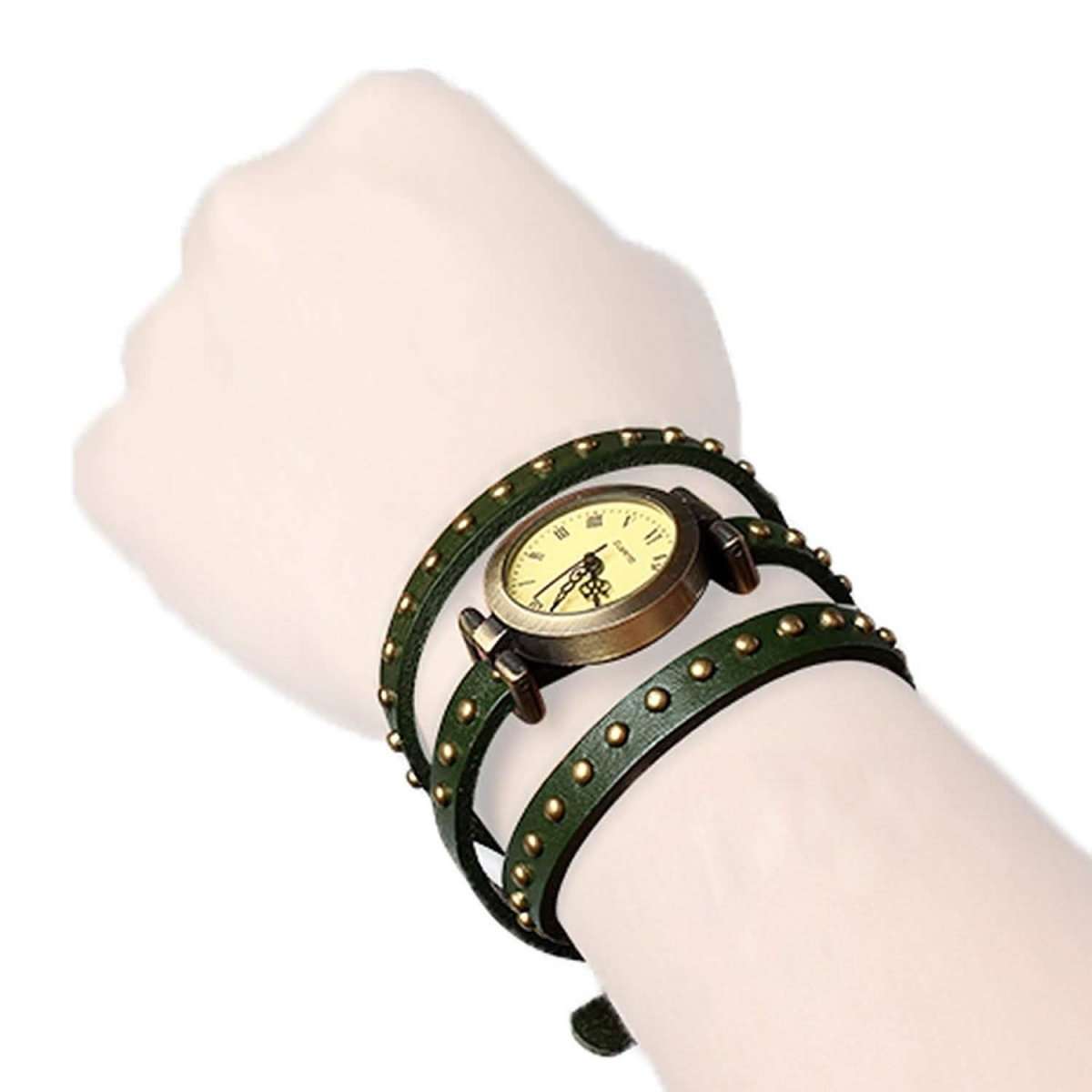 Retro leather belt watch with cream dial, dark green studded leather wrap on wrist.