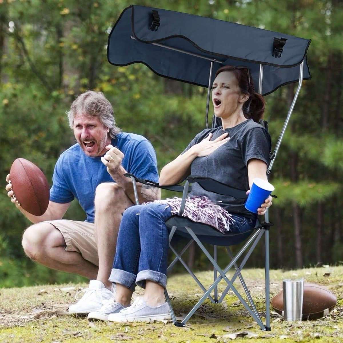 Navy foldable beach chair with sun canopy, cup holder side, and padded seat