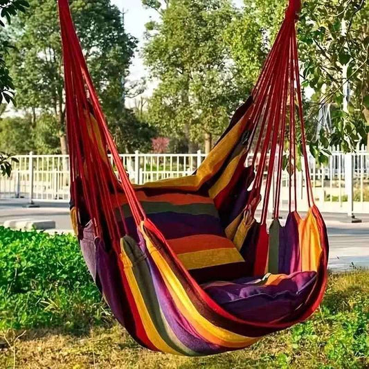 Multicolor hammock chair with red, yellow, and purple striped fabric and hanging ropes