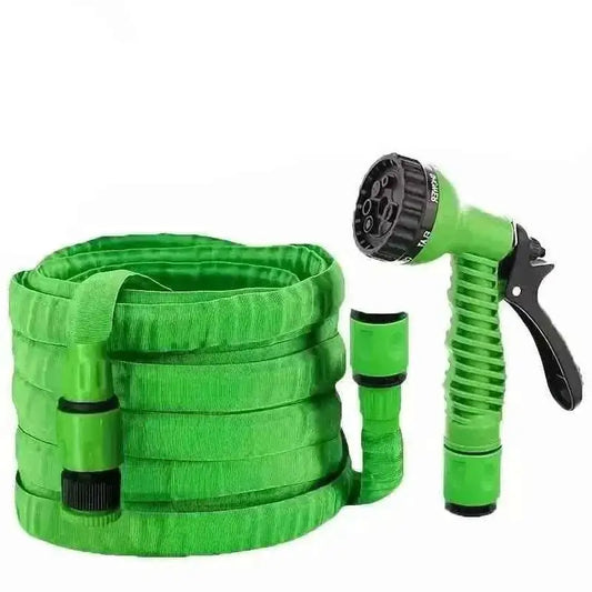 Green expandable hose with spray gun and trigger handle, plus quick-connect connector