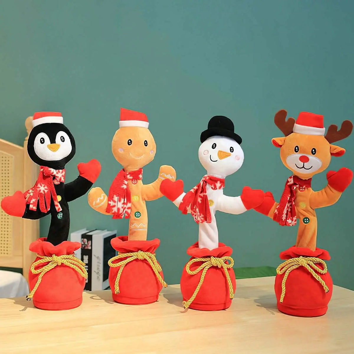 Four Christmas dancing toy animals on red fabric bags with scarves and Santa hats