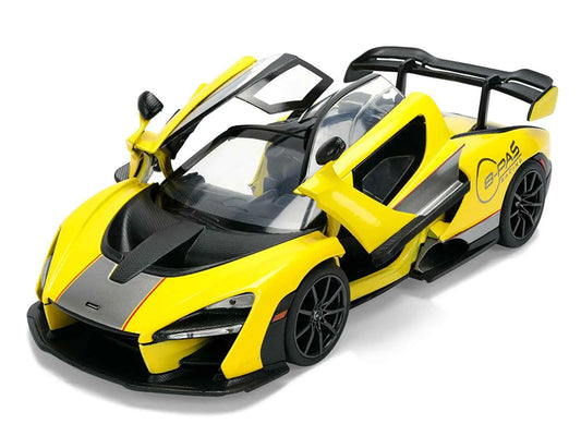 Yellow and black diecast race car model, angled view with raised hood and cockpit