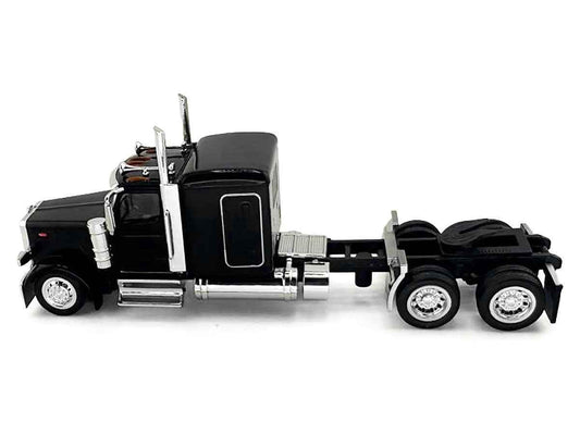 Black HO scale plastic semi truck model, side view with sleeper and chrome wheels