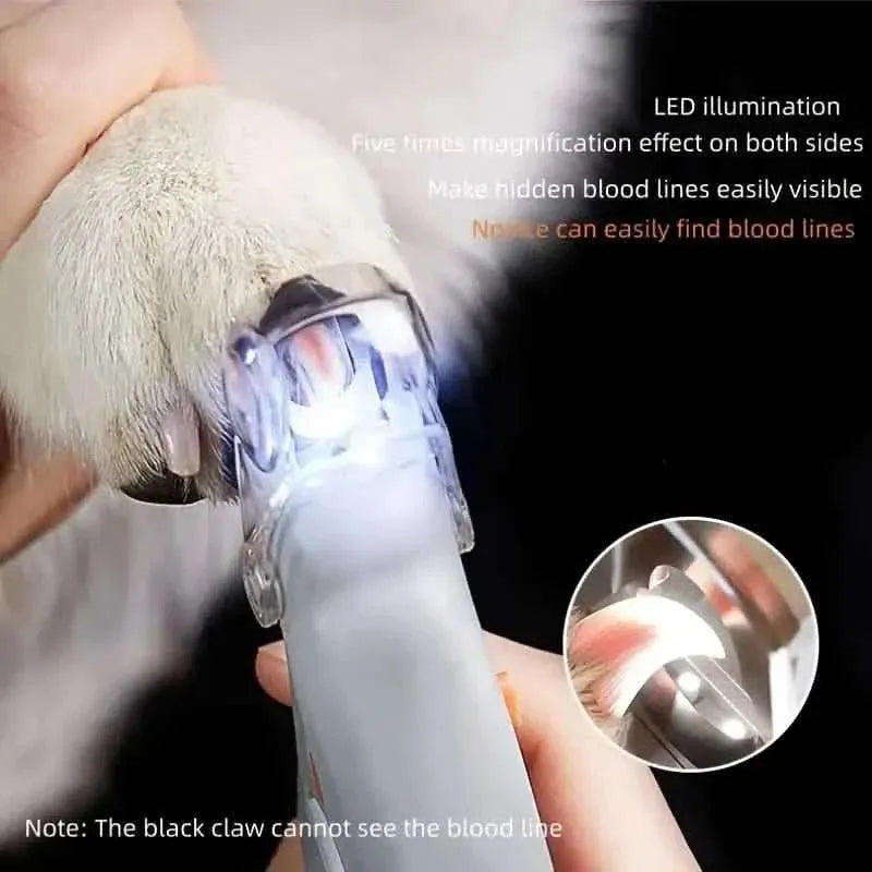 Pet nail clipper with LED-lit cutting area for easier nail trimming on a dog