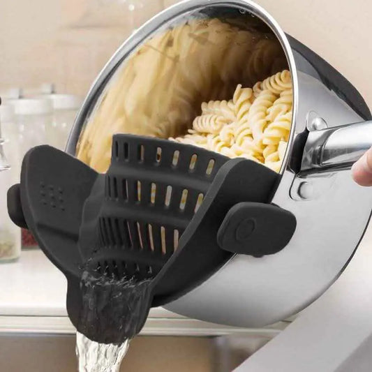 Black kitchen strainer insert with handle and raised perforations for draining