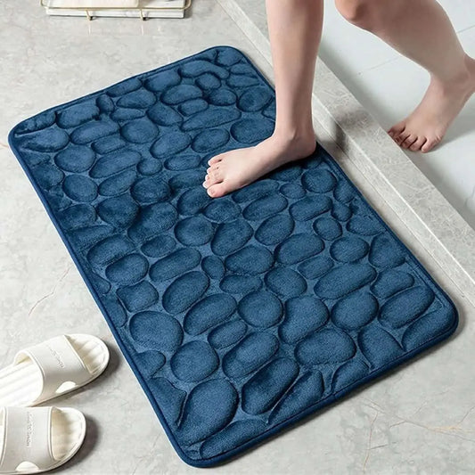 Navy pebble-embossed bath mat with non-slip backing