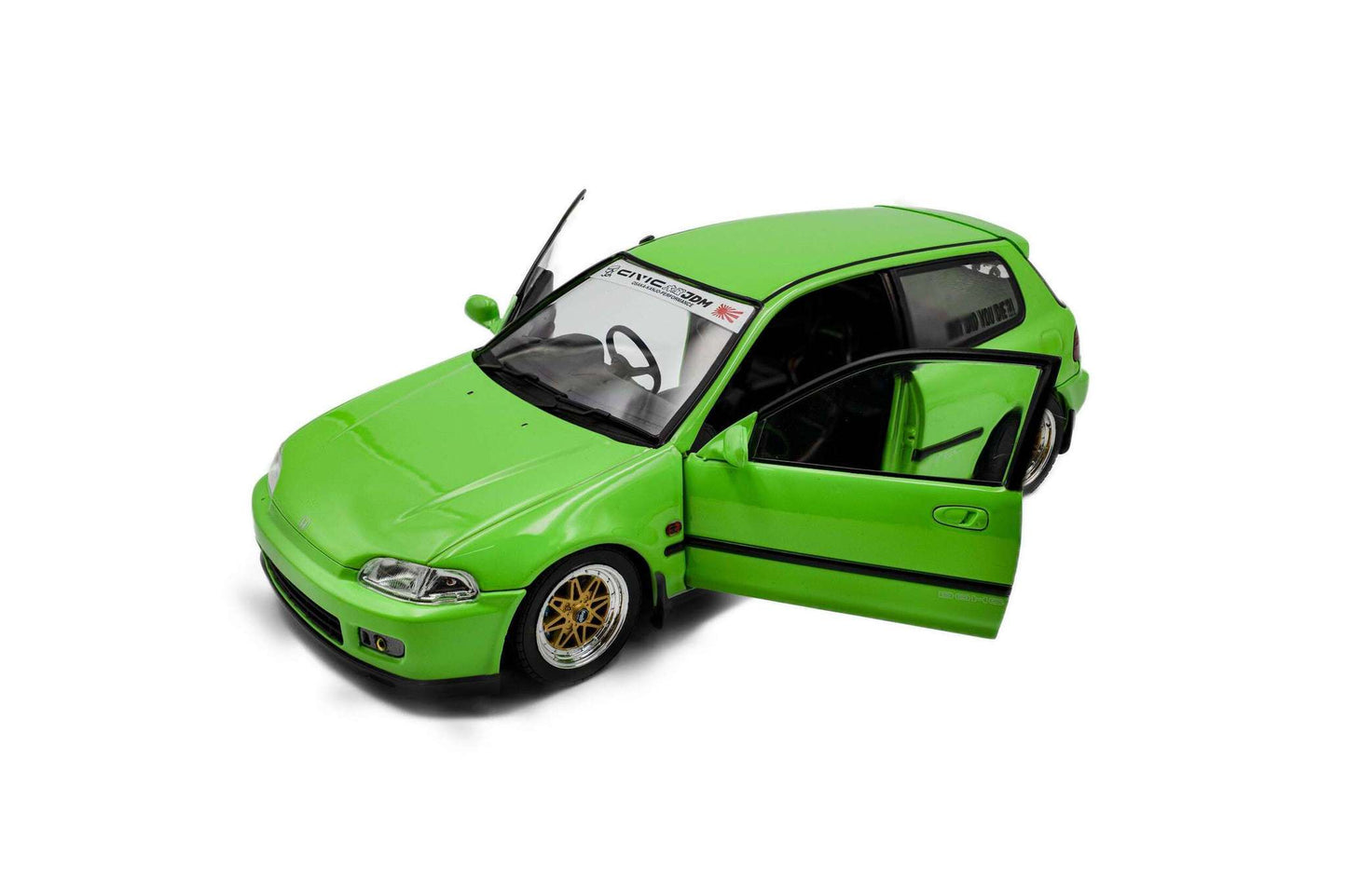 Green hatchback die-cast model car, front-left corner view with gold wheels.