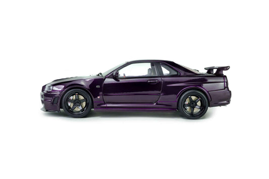 Purple 1:18 die-cast Nissan Skyline GT-R model in side profile, black wheels and spoiler