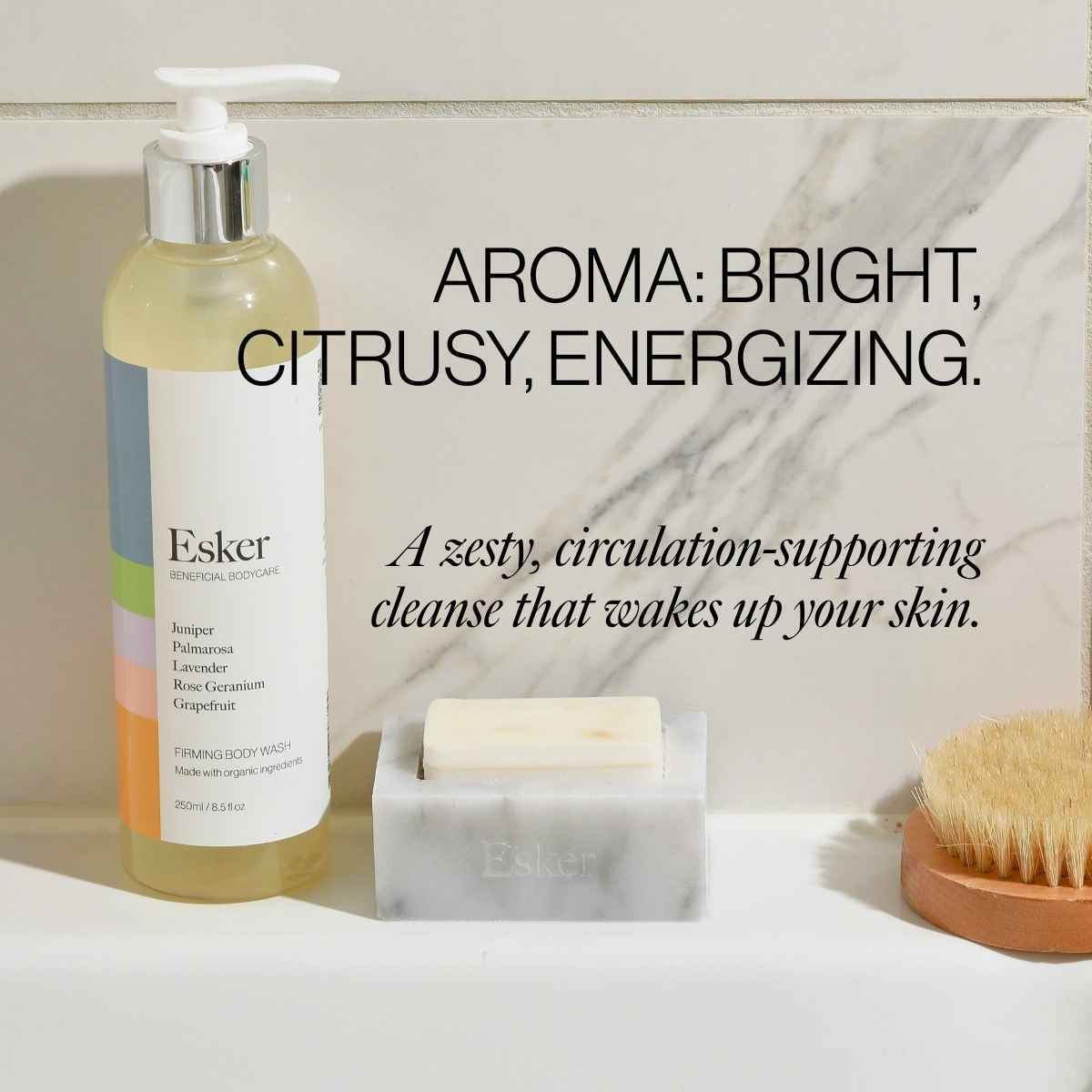 Esker firming body wash pump bottle with a bar soap on a bathroom counter