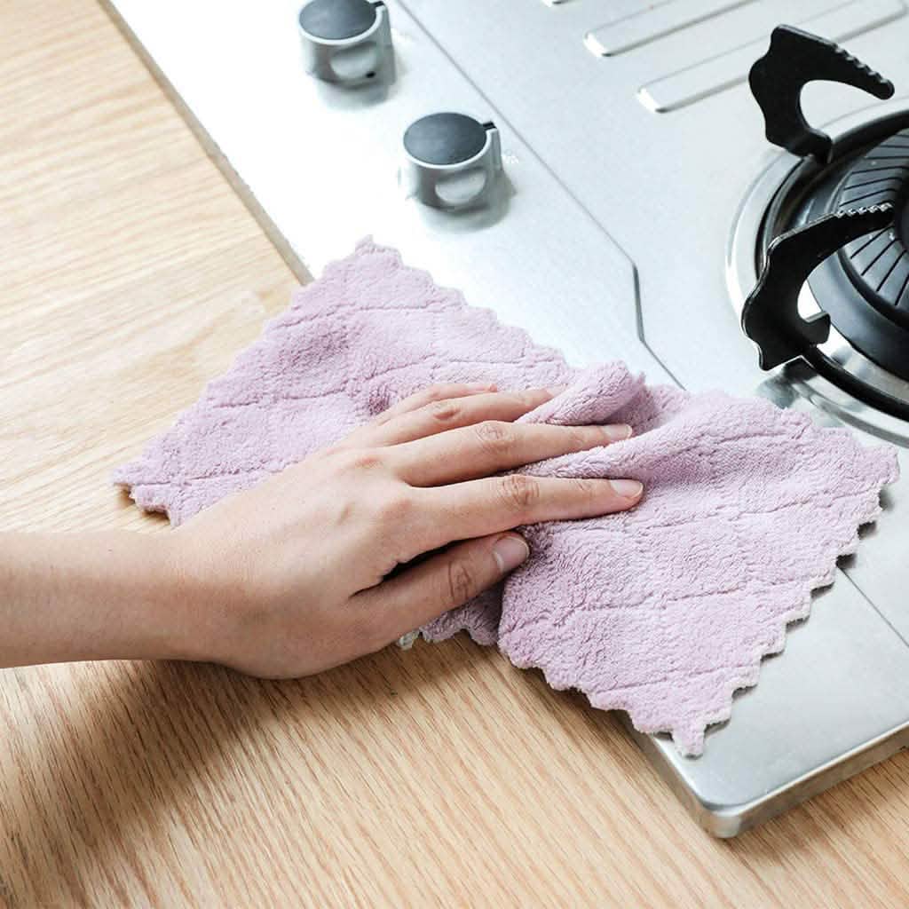 Lavender kitchen dish towel on countertop, held flat for wiping.