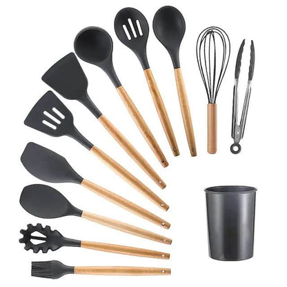 Gray silicone kitchen utensil set with wood handles, including spatulas and ladle