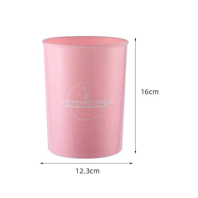 Pink silicone utensil cup for storing kitchen tools, shown with size dimensions