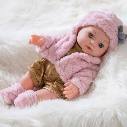 Lying pink plush baby doll in hooded outfit, gray ear hat, brown star romper, pink pacifier.