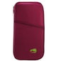 Travel passport wallet in deep red with front zip and small green logo patch