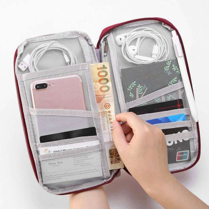 Travel passport wallet open with light gray interior, red trim, and cables in pockets