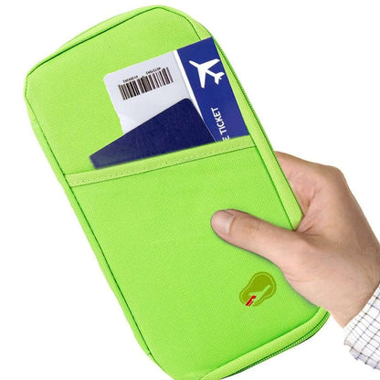 Green passport wallet with RFID-style icon, held by hand with ID card slots
