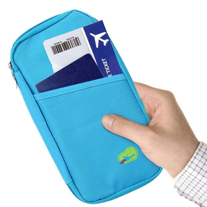 Blue passport wallet with zip closure, showing airline tag and small green logo on front.