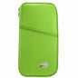 Green zip passport wallet with front seam and small dinosaur logo patch