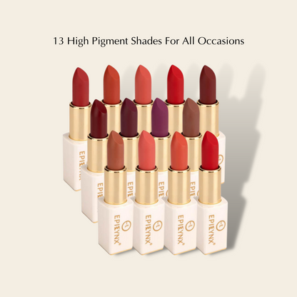 Row of matte lipsticks in white cases with gold tubes, displaying multiple high-pigment shades.