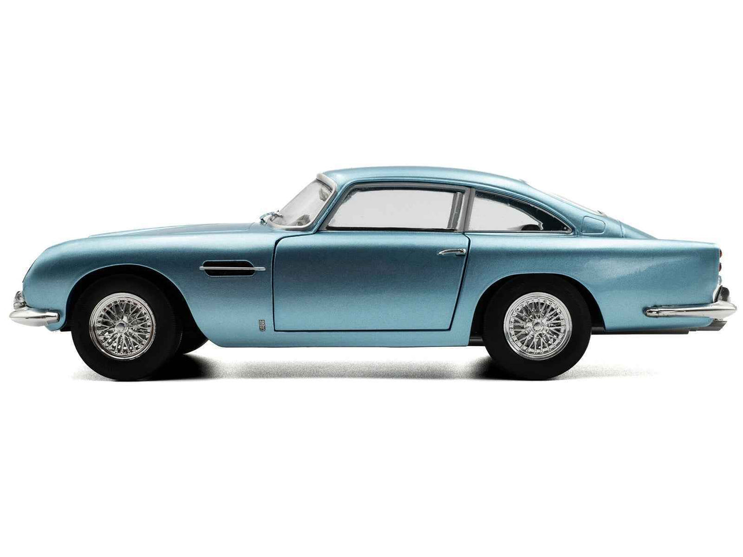 Light blue metallic RHD diecast coupe model car, side profile with wire wheels