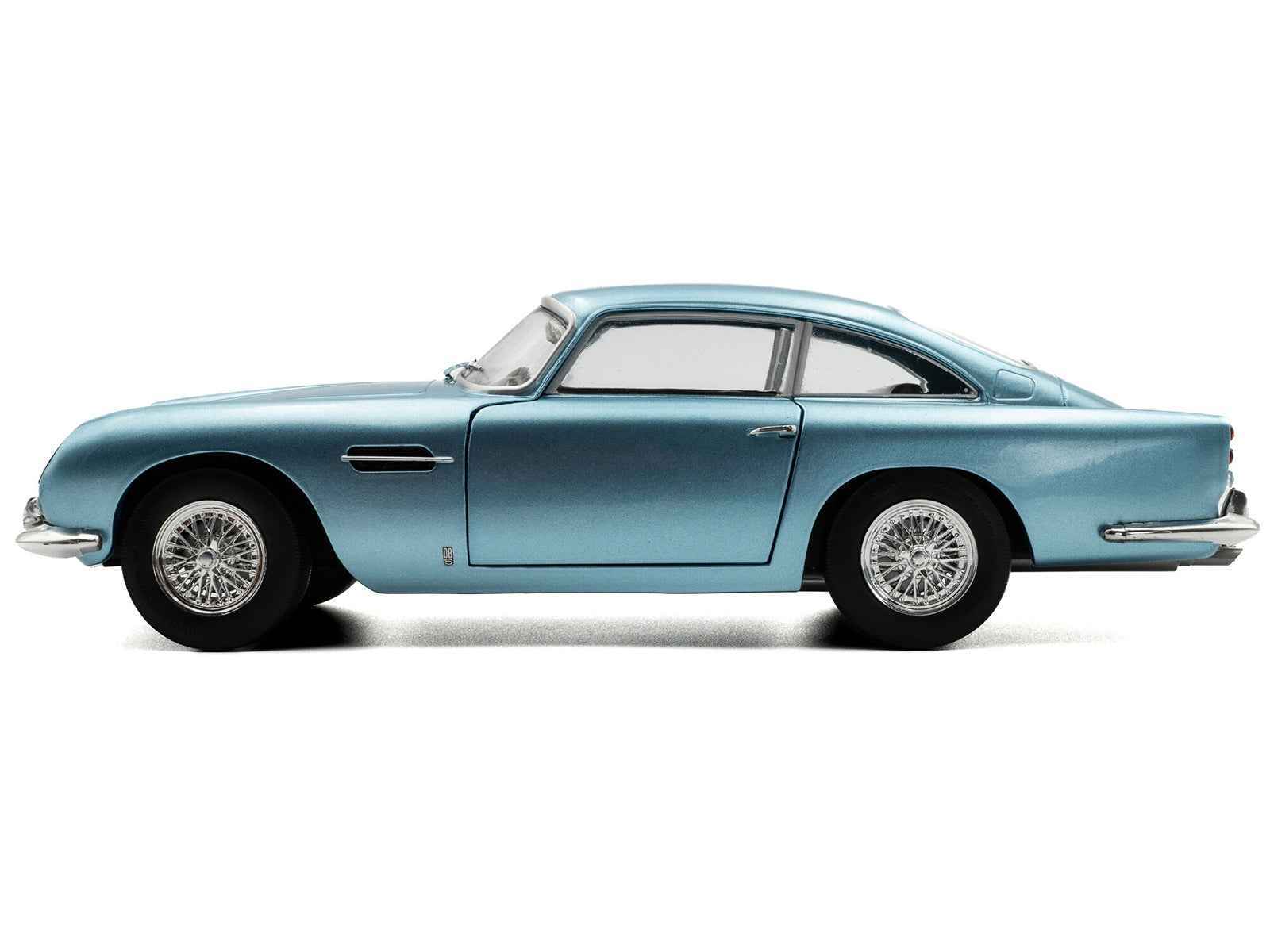 Light blue metallic RHD diecast coupe model car, side profile with wire wheels