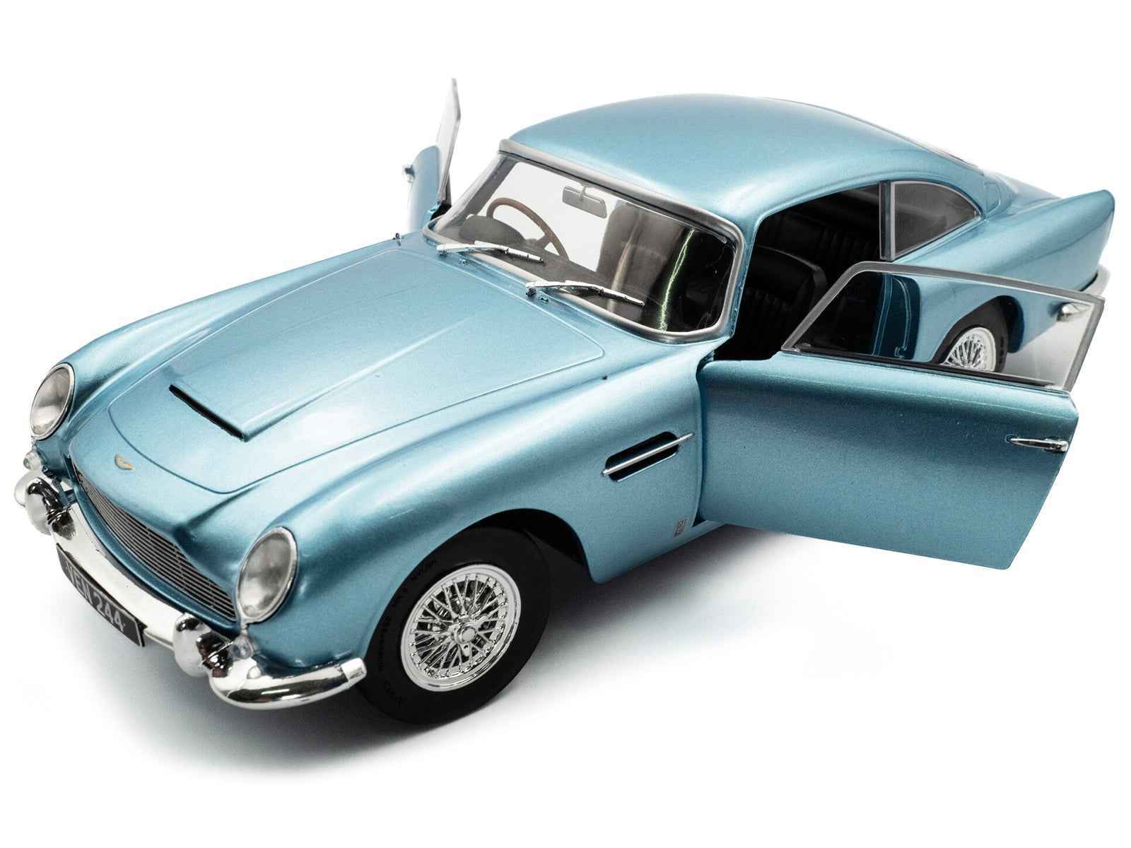 Light blue metallic RHD diecast coupe model, hood scoop and open driver door