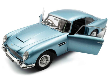 Light blue metallic RHD diecast coupe model, hood scoop and open driver door