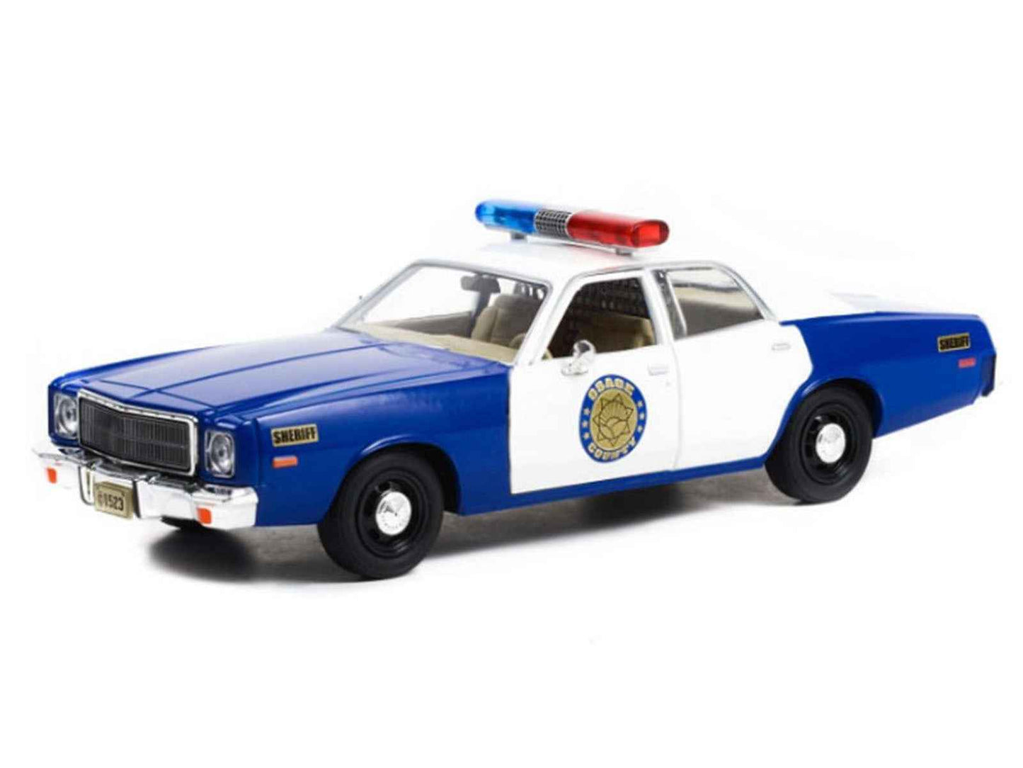 1/24 diecast police model car, blue and white with roof light bar, front 3/4 view