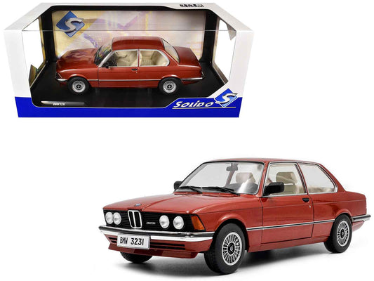 Ruby red metallic BMW 323i diecast model car in display box, front-left view