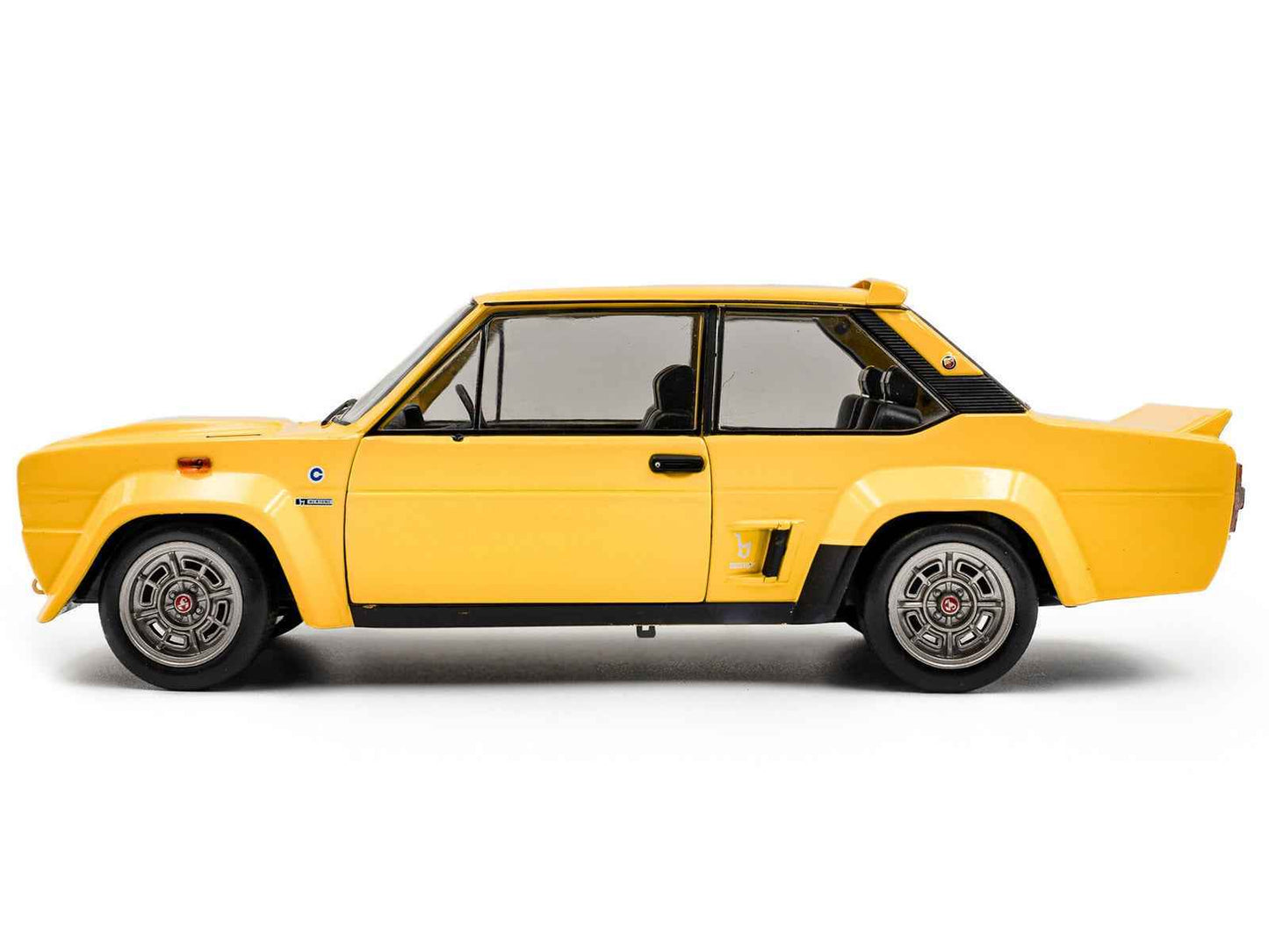 1980 Fiat 131 Abarth yellow diecast model car by Solido, side view